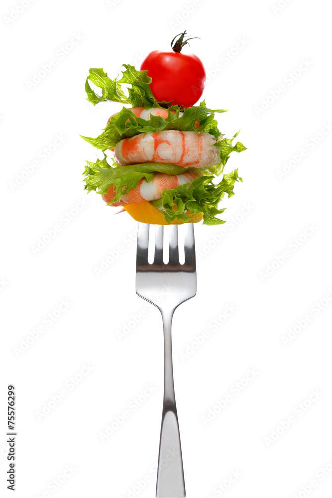 Mixed salad on fork isolated on white