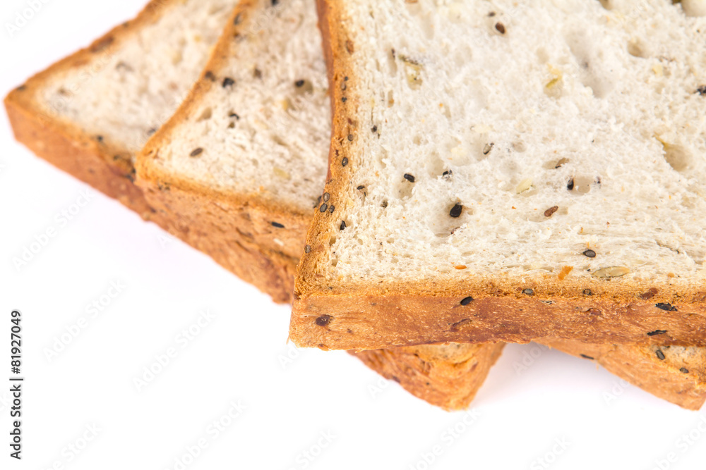 selective focus closeup cereal and black sesame bread on white b