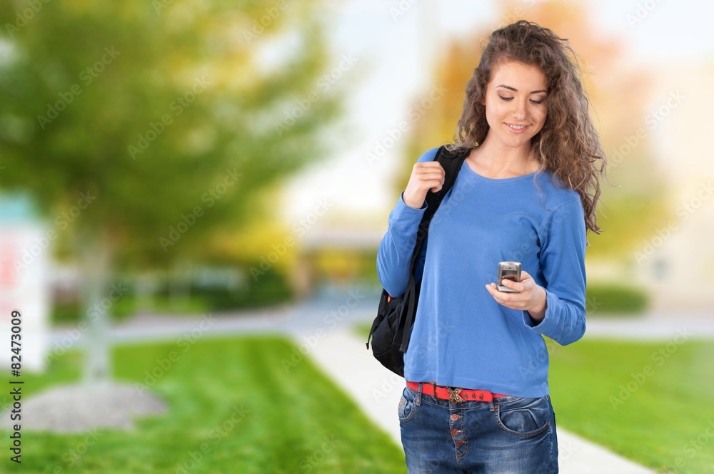 Text Messaging. Teenage Girl with Cellphone