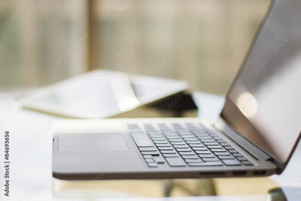Laptop and digital tablet, shallow depth of field