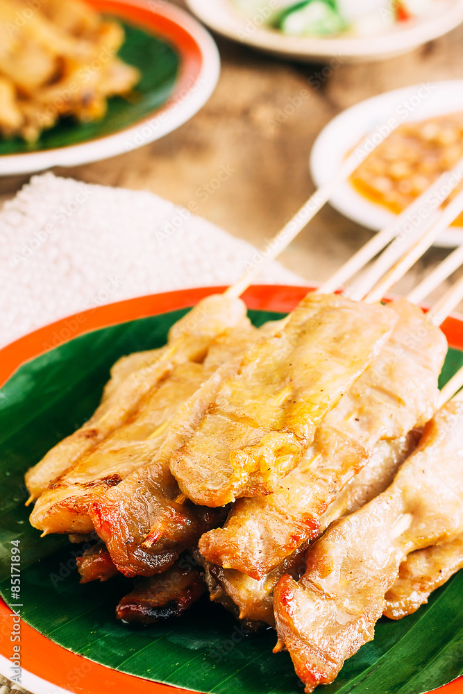 Pork Satay with delicious peanut sauce, one of famous local dishes.