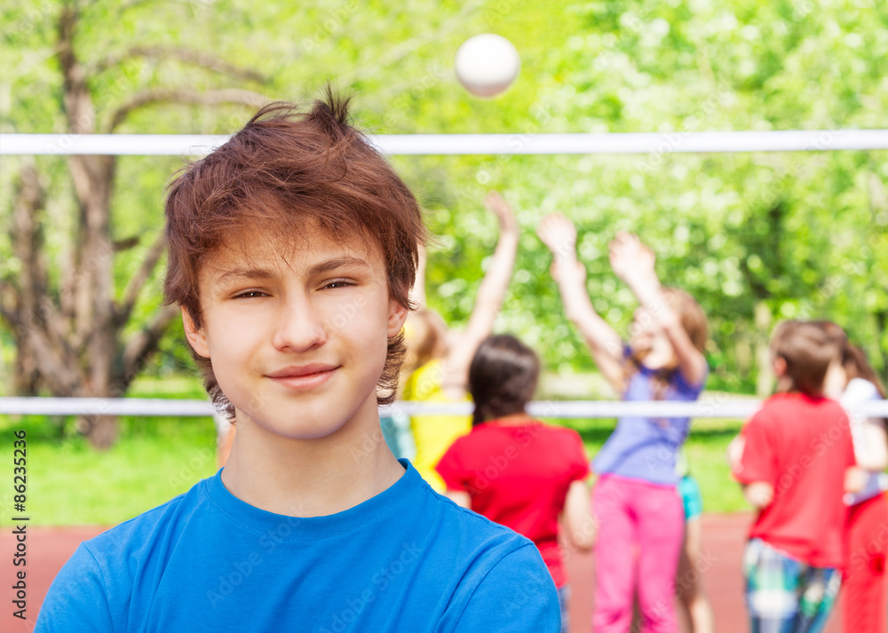 Close-up of teenager boy standing on playground