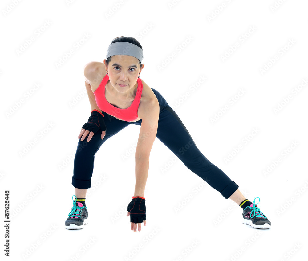 Middle aged woman exercising isolated on white background