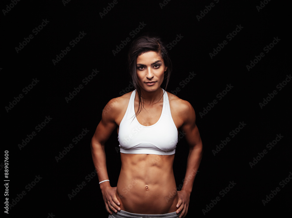 Confident fitness woman wearing sport bra