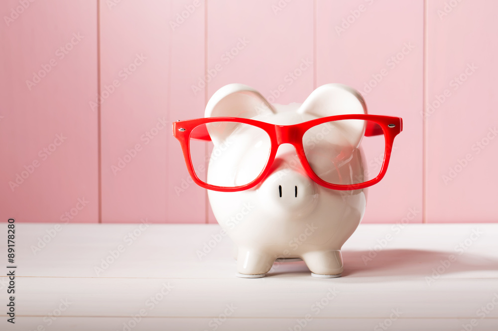 Piggy bank with red glasses