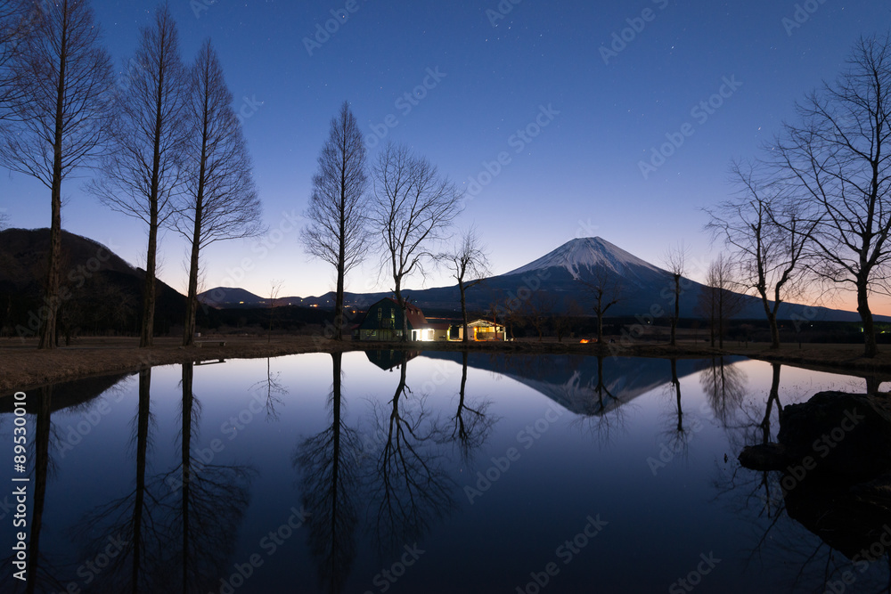 Sunrise landscape with mount Fuji and reflection in water.