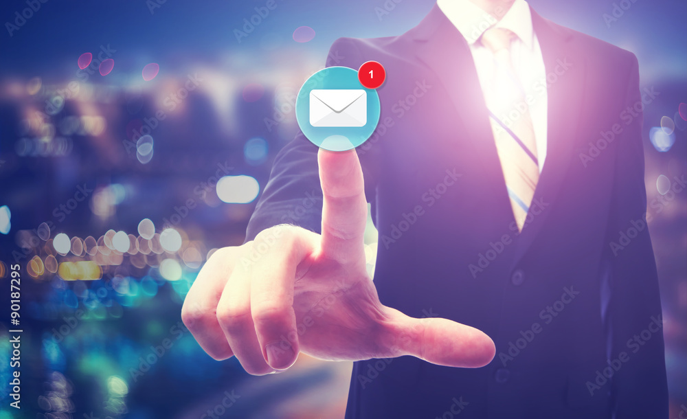 Businessman pointing at email icon