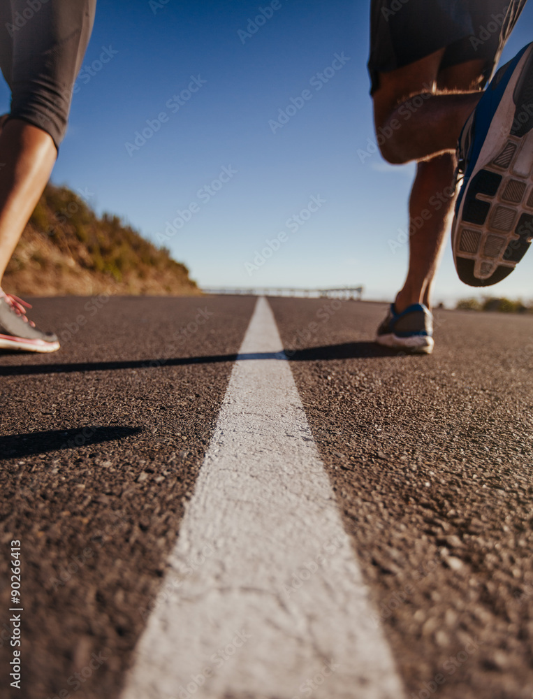 Runners on middle of the road