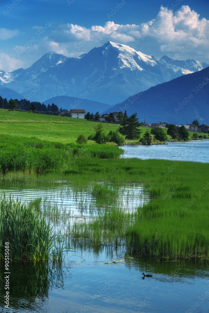Beautiful view of the lake Muta (Haidersee) and Ortler peak, located near the village St. Valentin, 