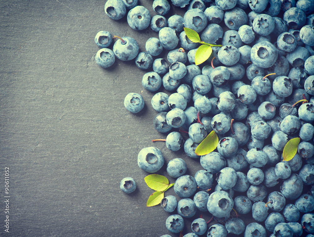 Blueberries vintage style over dark background. Blueberry closeup