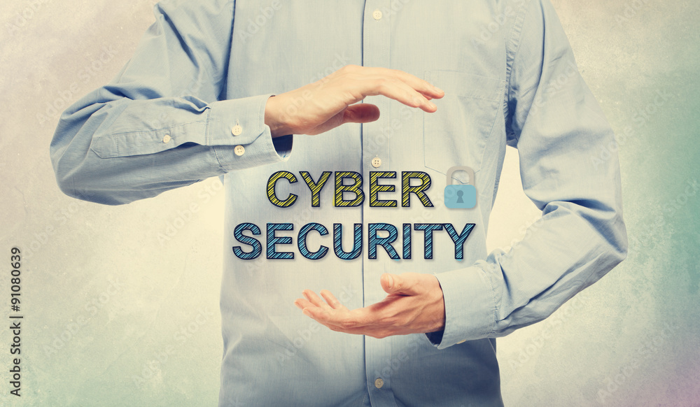 Young man in blue shirt holding Cyber Security