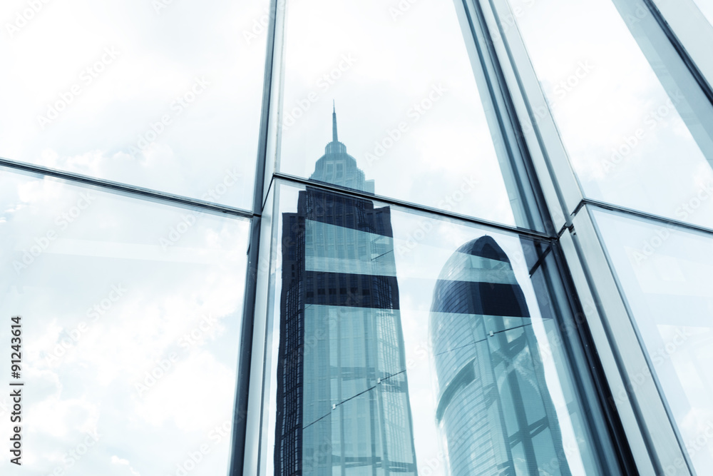 landmarks reflection on glass walls of skyscrapers