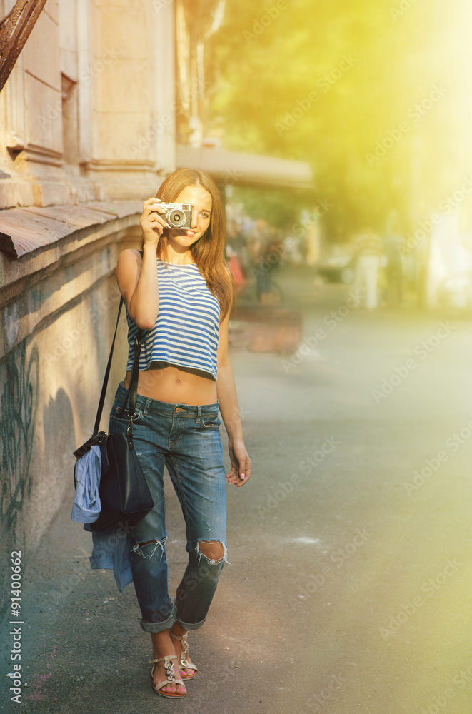 Girl photographing on the old europe street