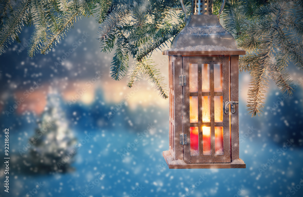 Christmas lantern hanging on fir branches