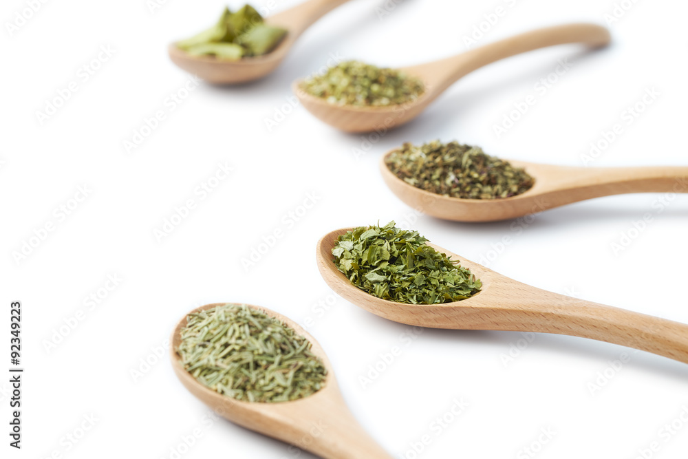Dried Herbs on Wooden Spoons