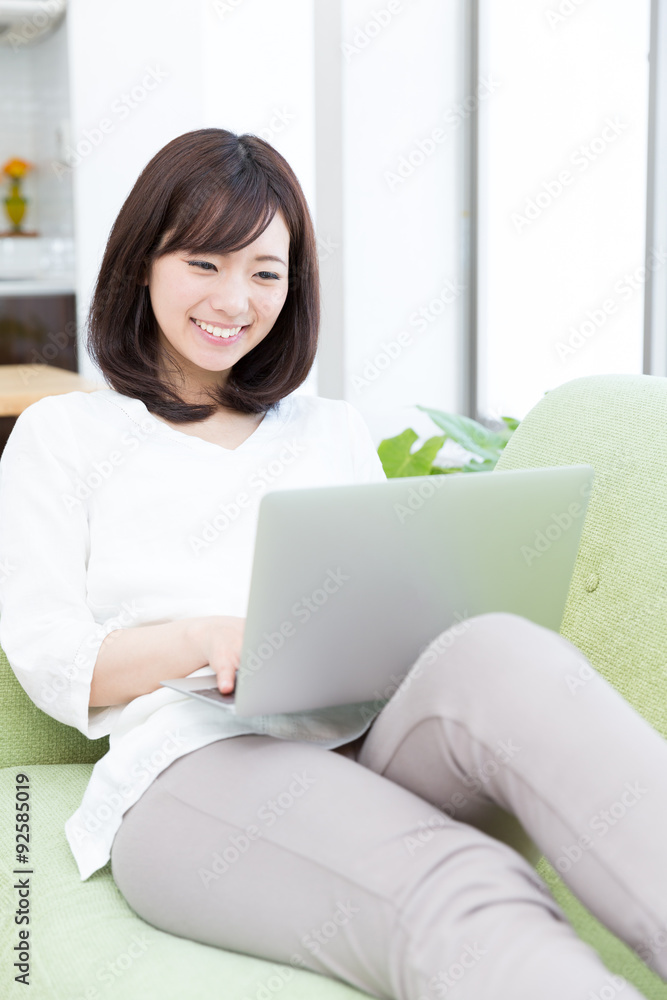 young asian woman using laptop