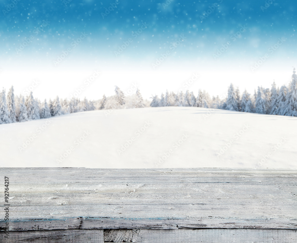Winter snowy background with wooden planks