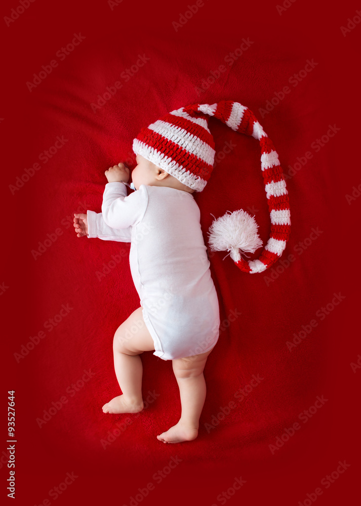 Baby in red white knitted hat