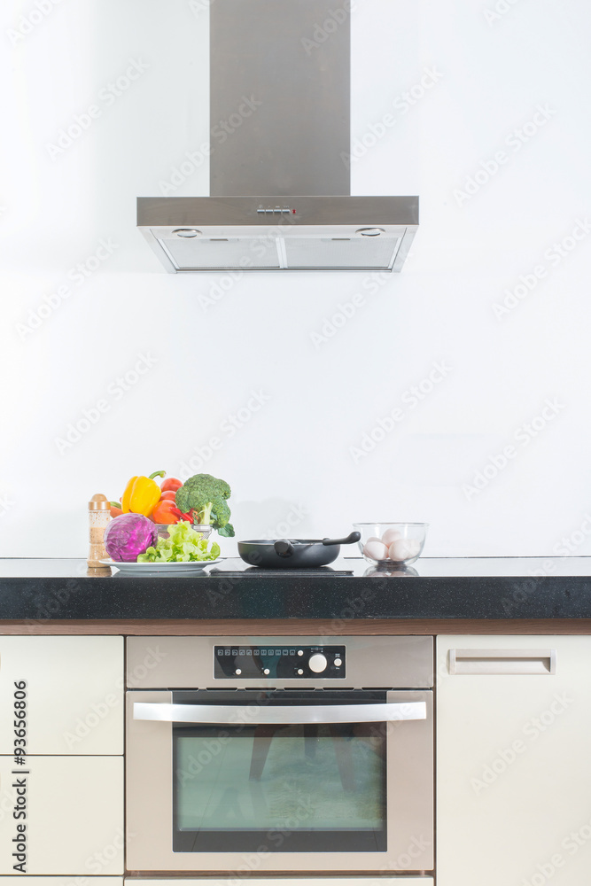 Modern gourmet kitchen interior with vegetable ,egg and pan