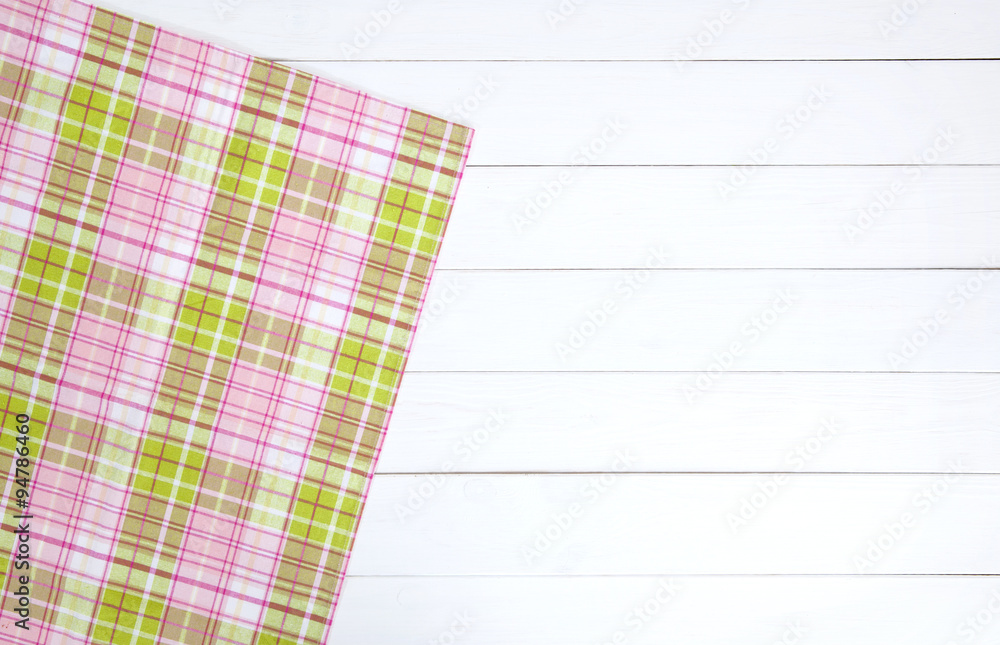 textiles and wood texture. white wooden table. cloth on light wooden texture. colorful cloth on the 