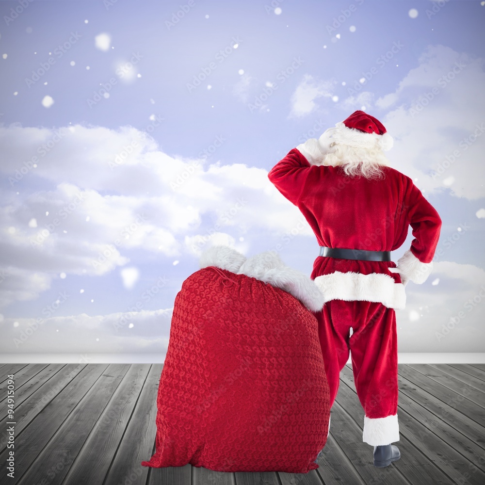 圣诞老人与一袋礼物的合成图像