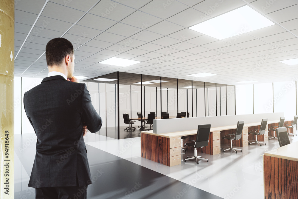 Businessman in shiny open space office