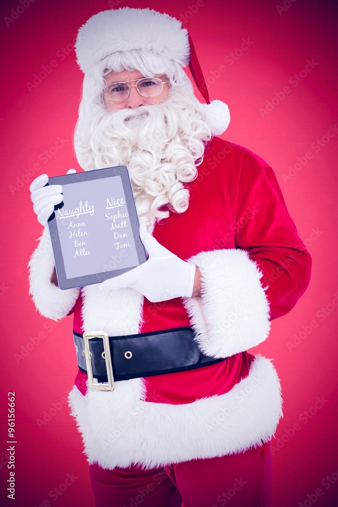 快乐圣诞老人展示数字平板电脑的合成图像
