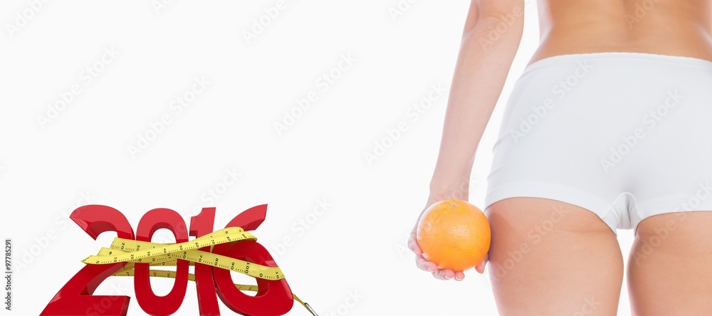 健康女性腹部与橙色的合成图像