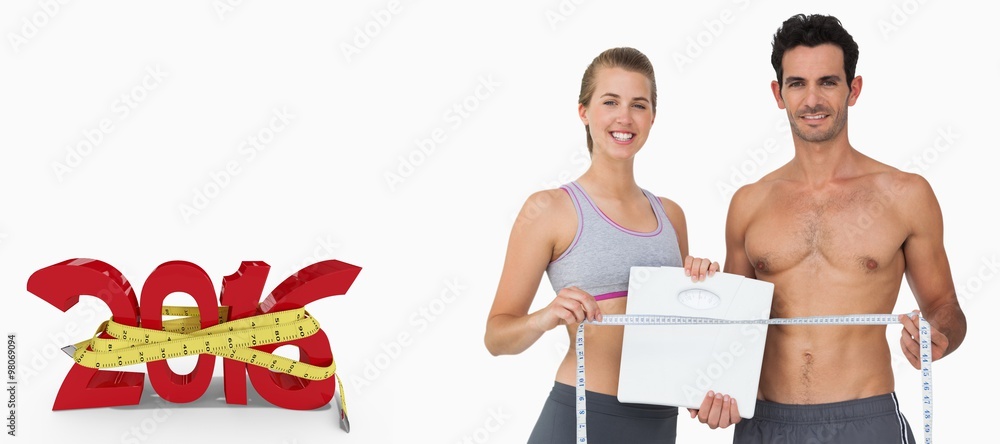 Sporty couple holding scales and measuring tape