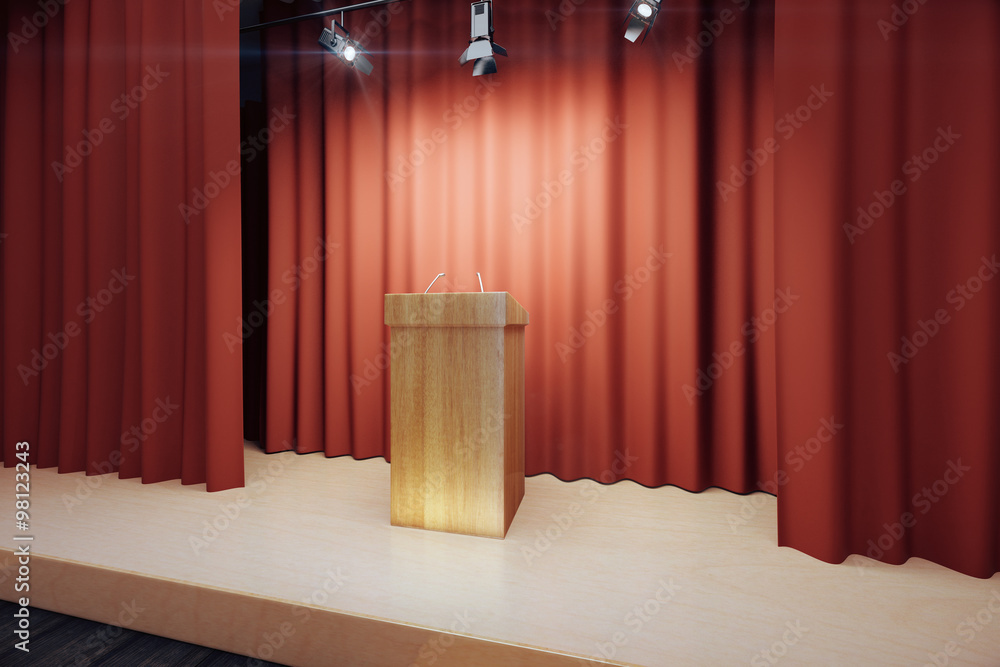红色场景的舞台上的木制论坛