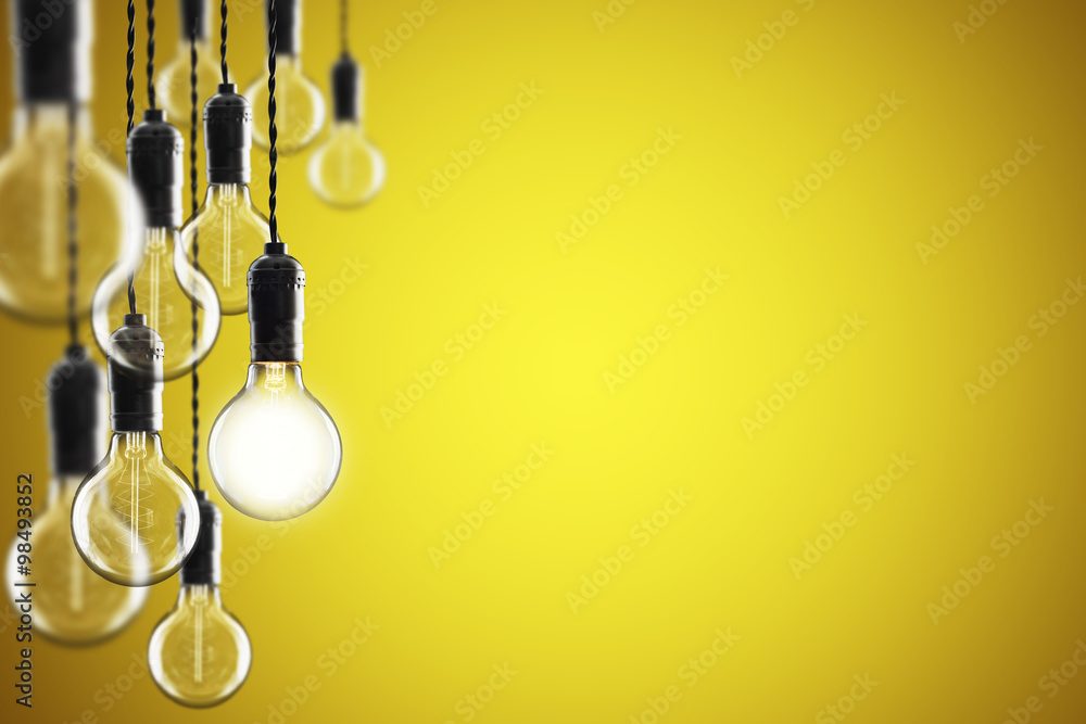 Idea and leadership concept Vintage  bulbs on color background,
