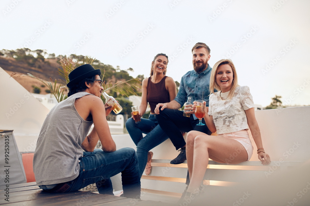 Young people having drinks at party