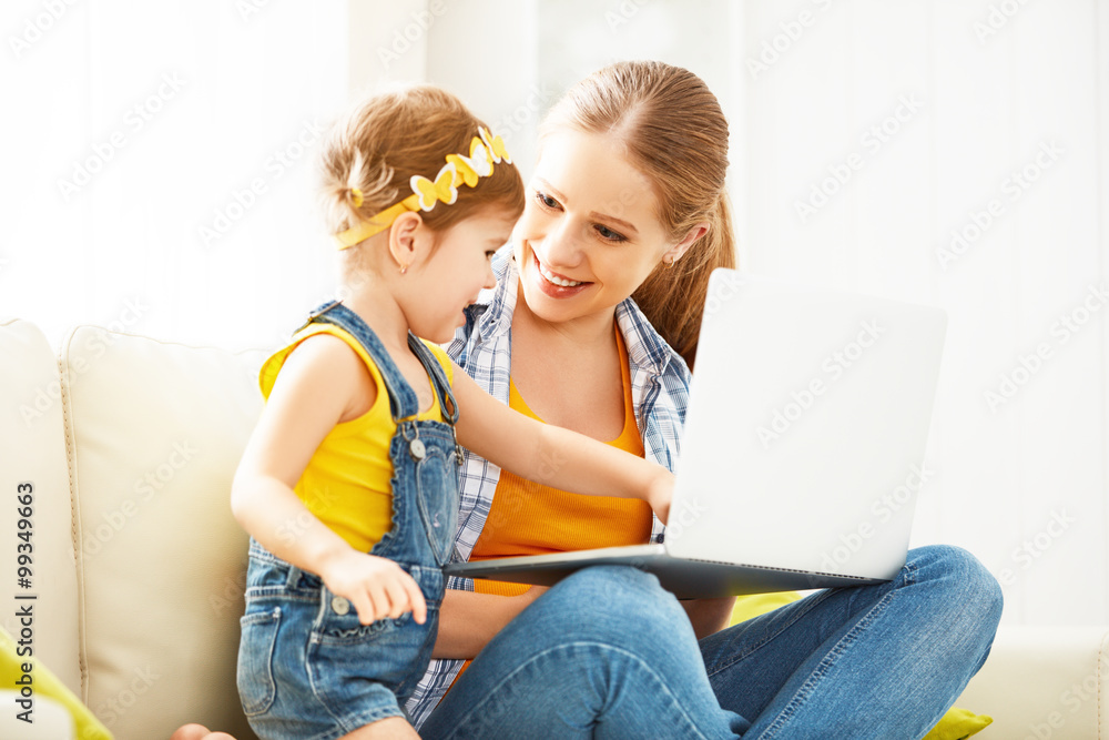 mother and child with  laptop computer