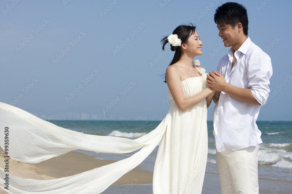 Happy newlyweds on the beach