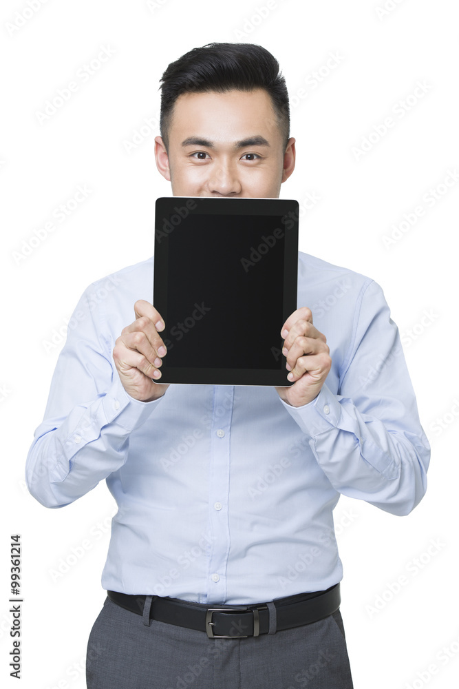 Young businessman holding a digital tablet