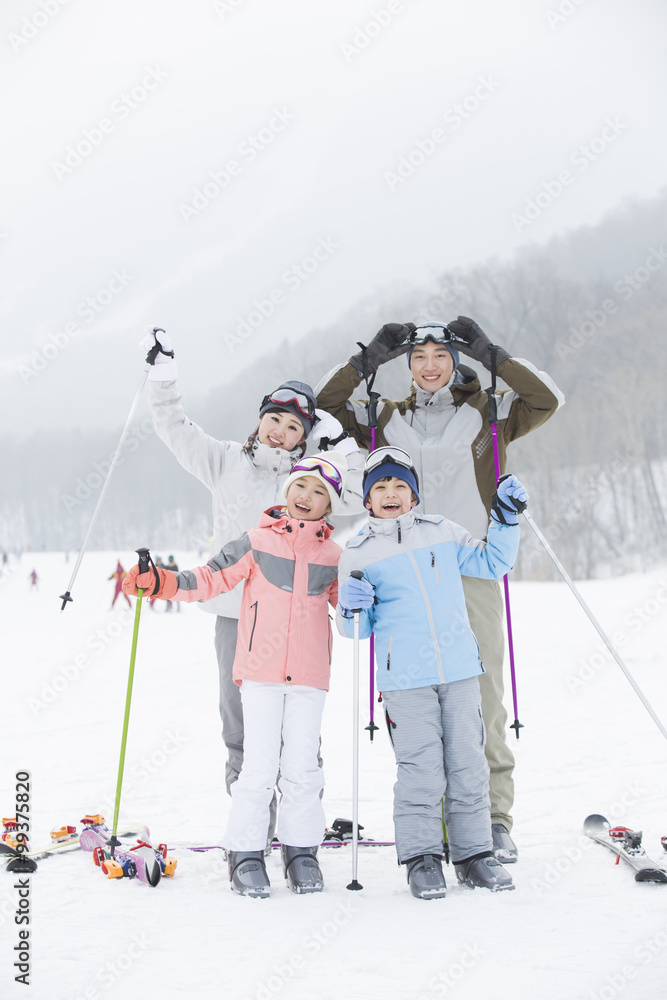 Young family skiing in ski resort