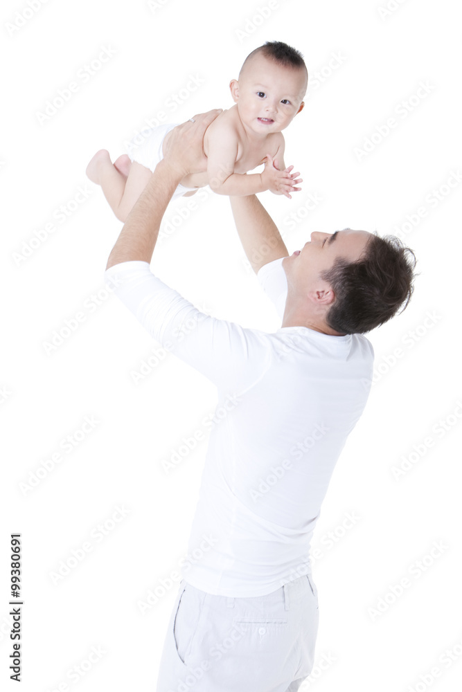 Young father holding his baby aloft