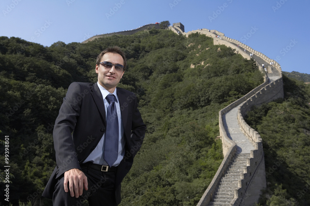 Businessman Standing On The Great Wall Of China