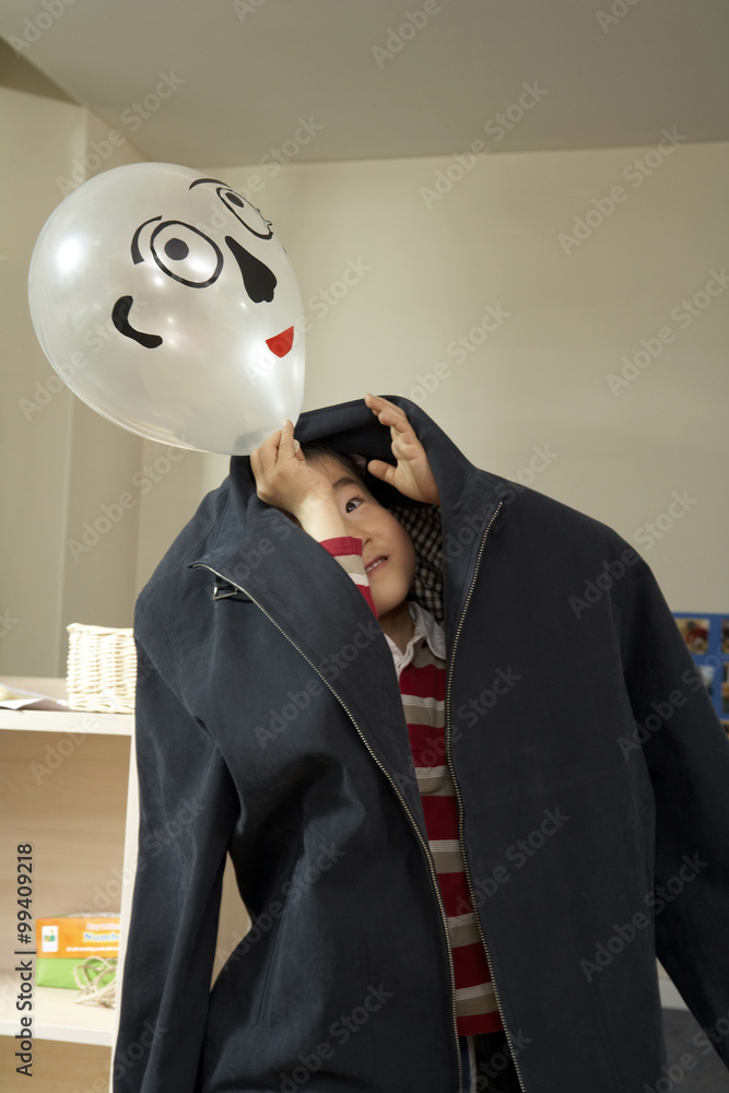 Boy Pretending To Be A Grown Up With A Balloon For A Face