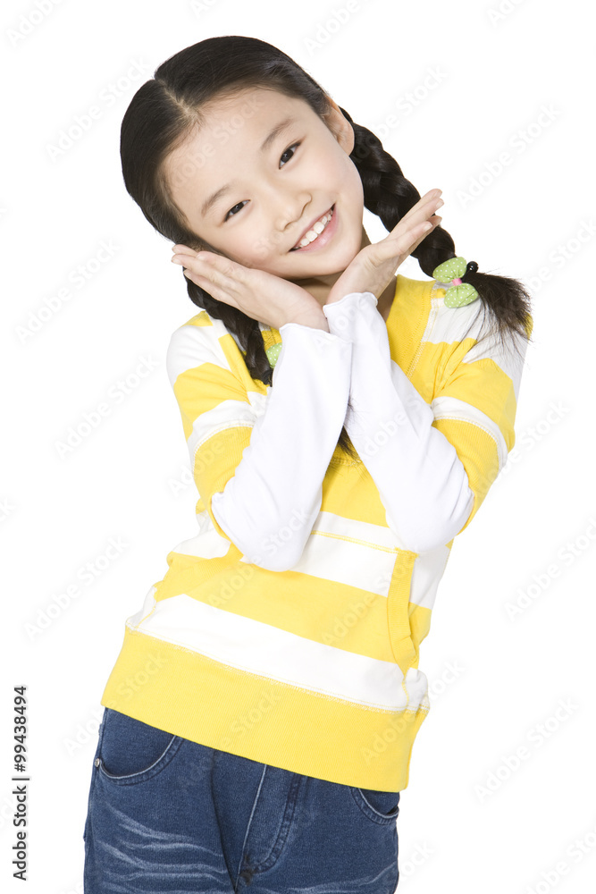 Young girl smiling with her hands on chin