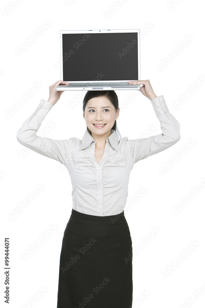 Young businesswoman showing off a laptop