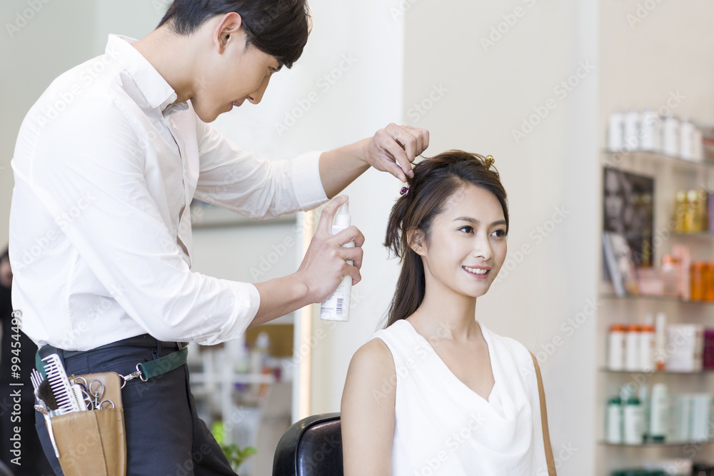 Hairdresser working on customer