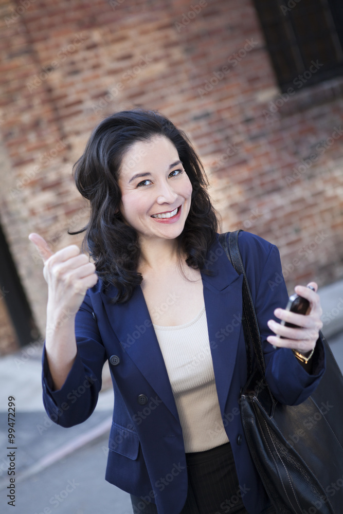 Businesswoman doing thumbs up