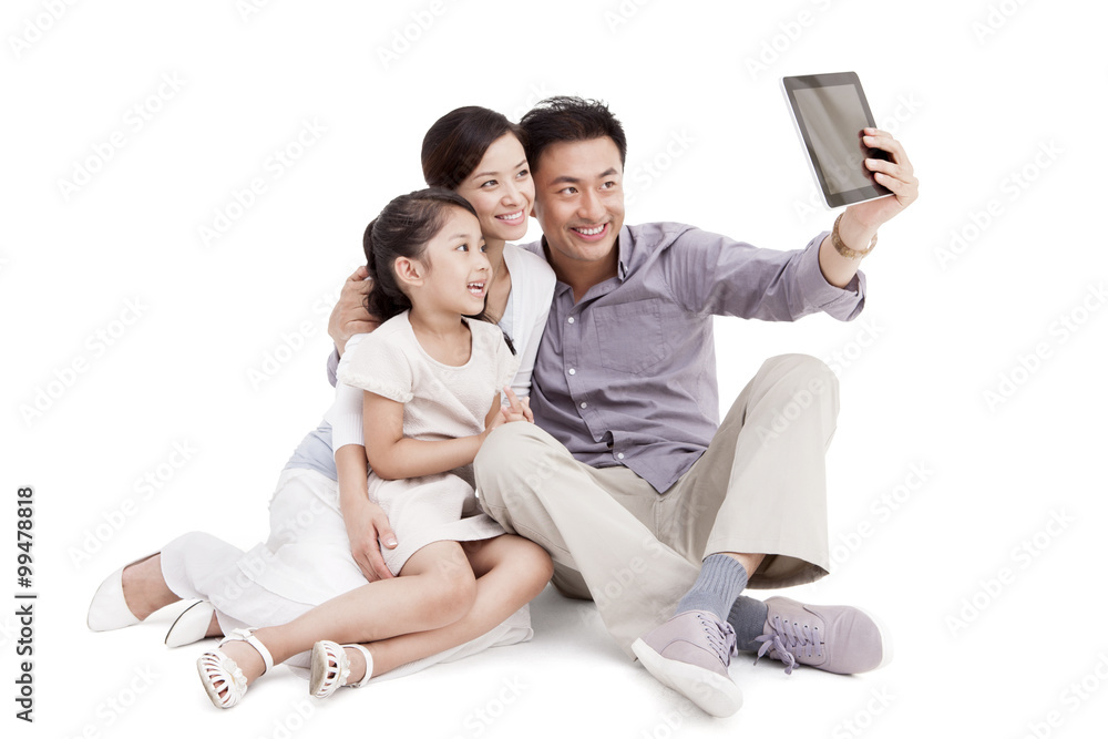 Family doing self portrait photography with digital tablet
