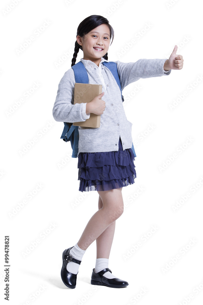 Happy schoolgirl doing thumbs up