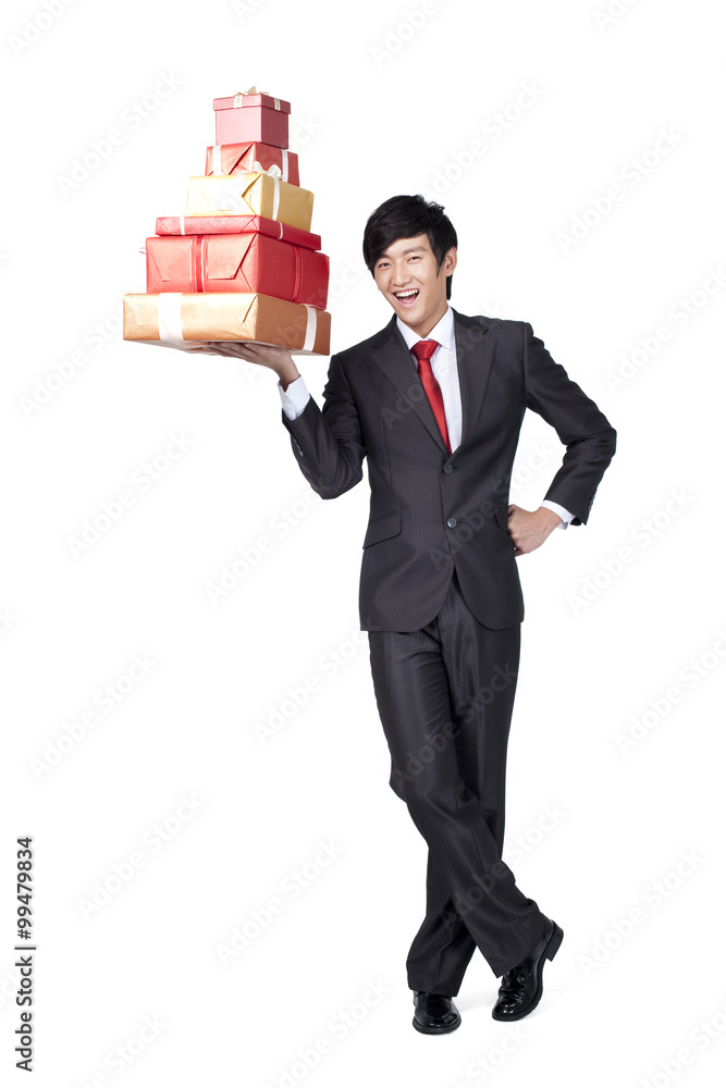 Excited Businessman Holding a Stack of Gifts