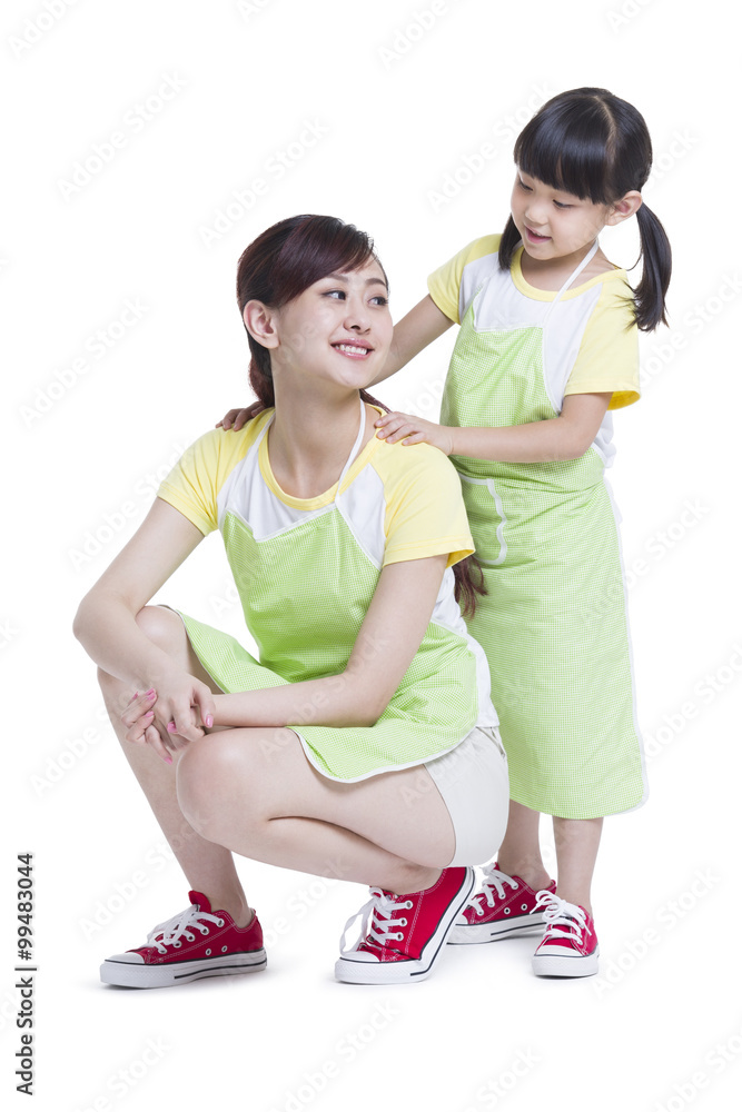 Daughter massaging mothers shoulders