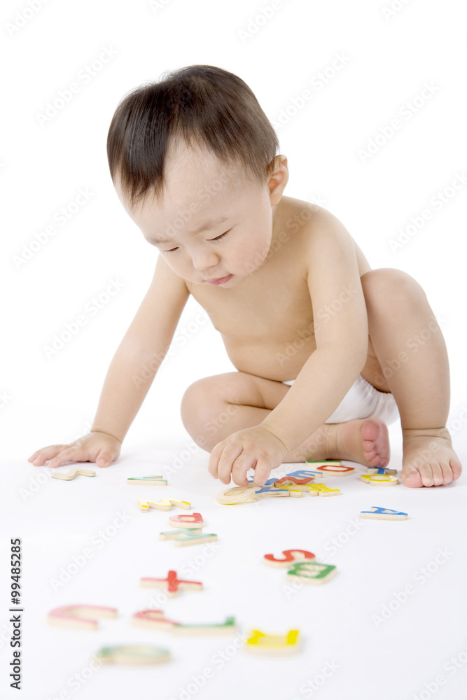 Infant with Alphabet Puzzle Pieces