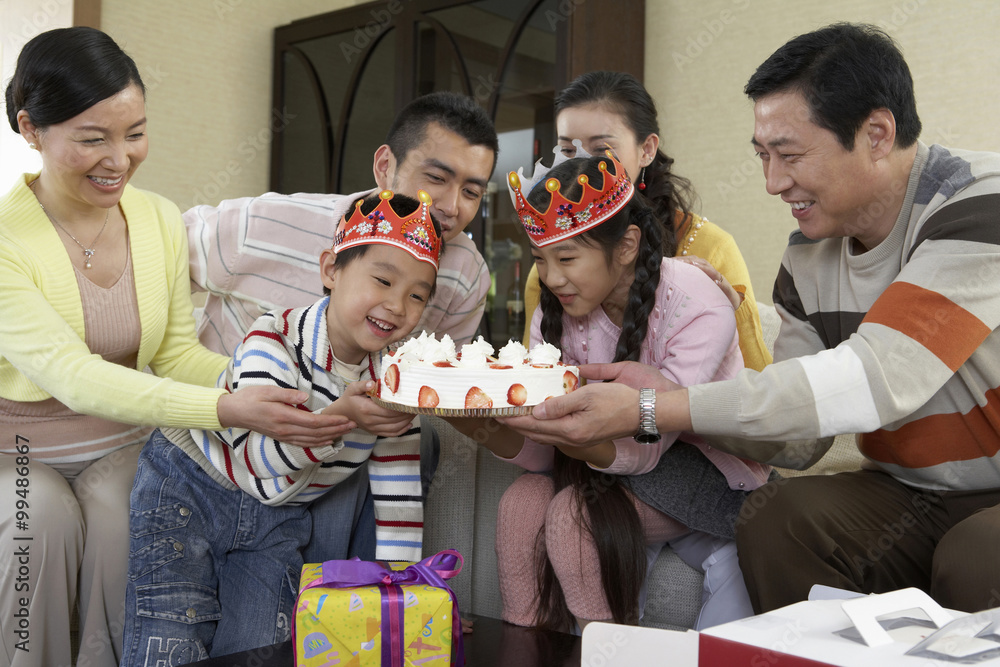 Children Looking At Birthday Cake