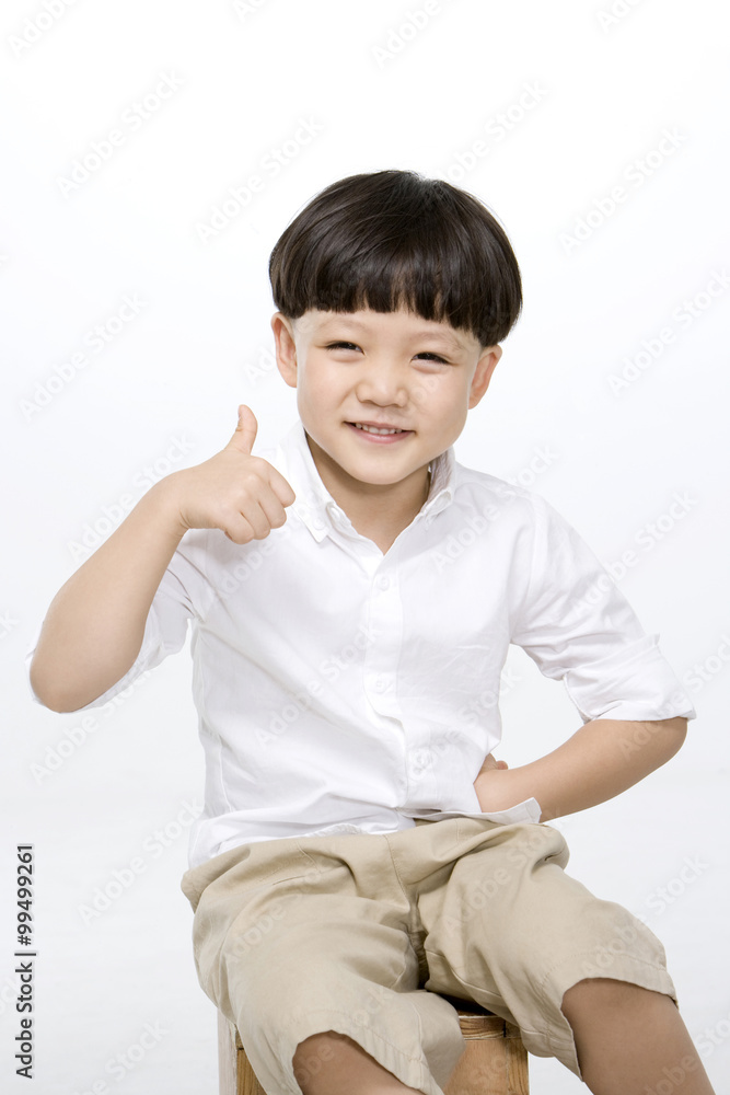 Little boy giving a thumbs up